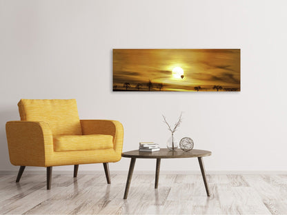 Leinwandbild Panorama Sonnenuntergang mit Heissluft Ballon