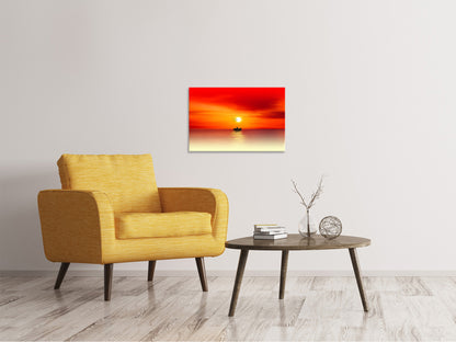 Leinwandbild Ein Fischer im Sonnenuntergang