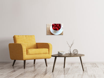 Leinwandbild Eine Tasse Himbeeren