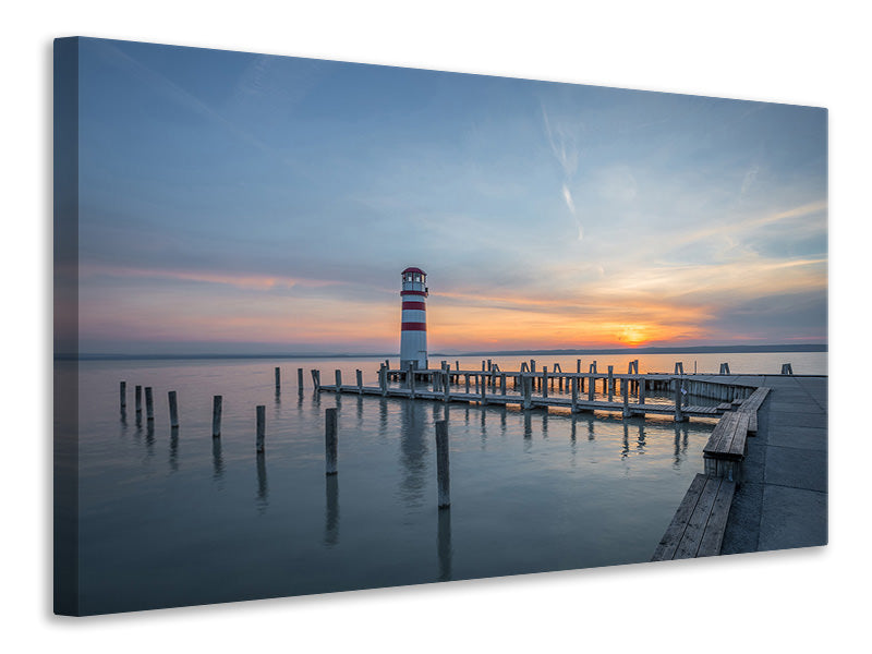 Leinwandbild Leuchtturm im Sonnenuntergang